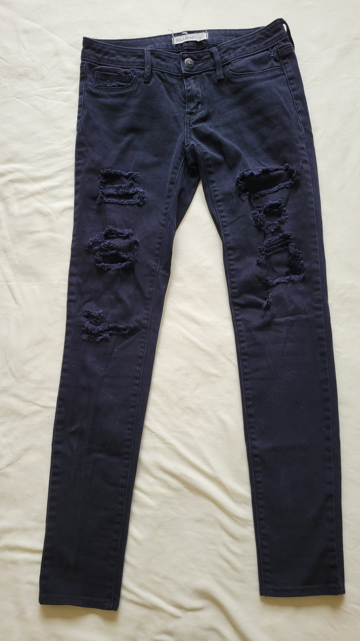 Ripped black skinny jeans
